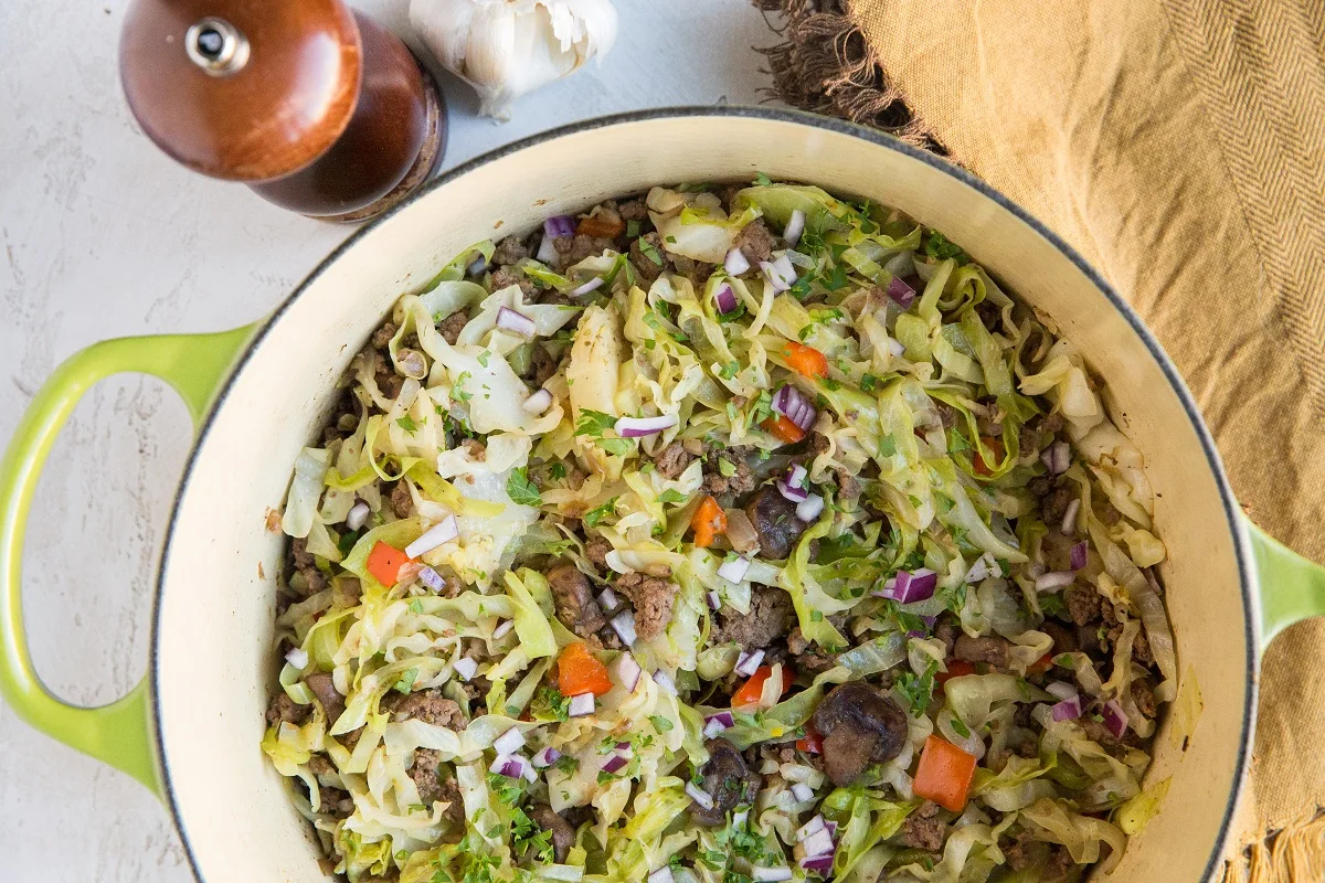 Cook the cabbage and ground beef until the liquid has burned off