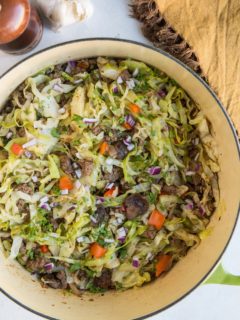 Easy One-Pot Ground Beef and Cabbage with onion, garlic, bell pepper, and mushrooms. An easy healthy low-carb dinner recipe that comes together in 30 minutes.