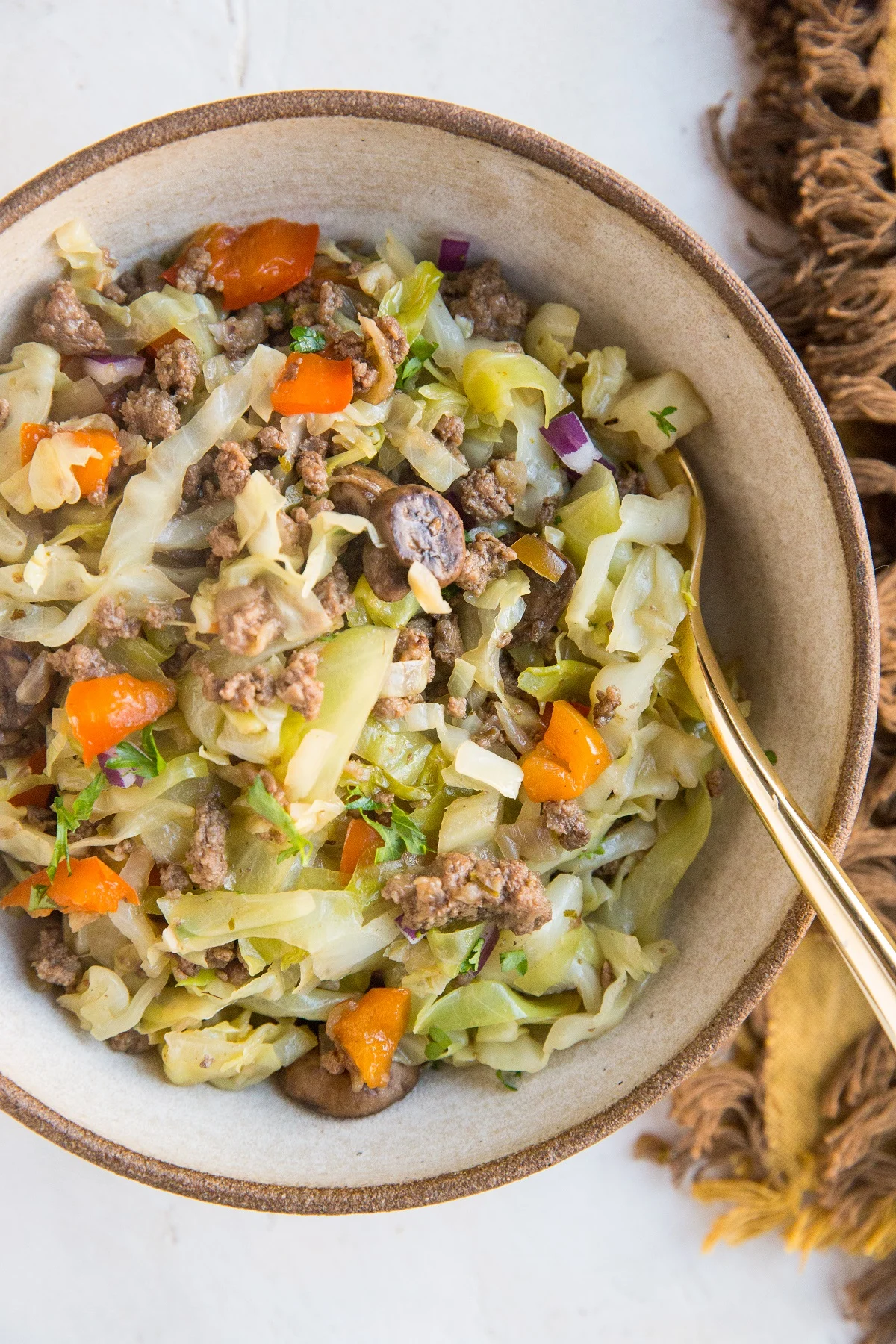 Ground Beef and Cabbage with onion, mushrooms, garlic, and bell pepper. An easy one-pot meal that comes together in 30 minutes