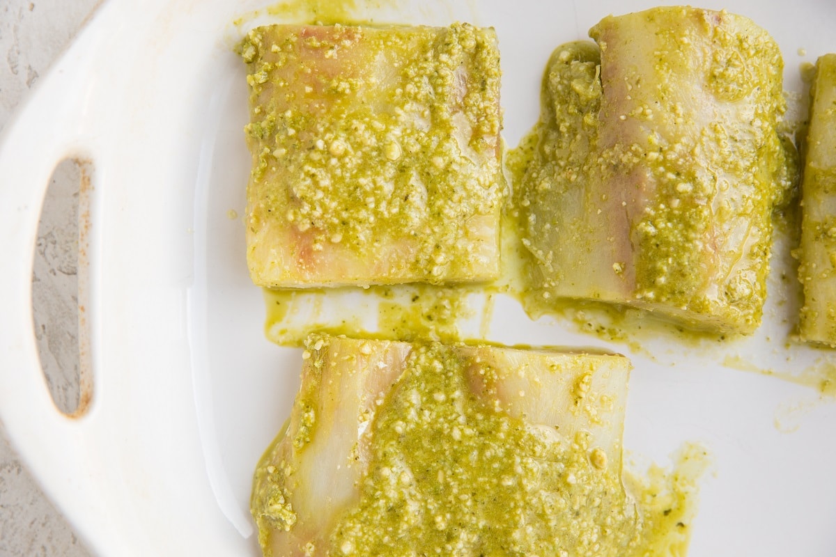 Pesto marinated cod recipe. Pesto cod in a casserole dish