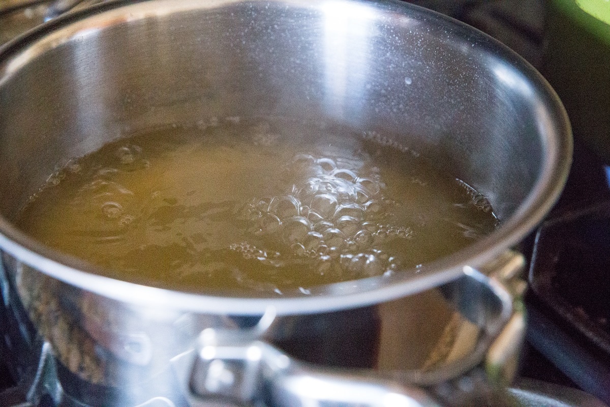 Bring the chicken broth to a boil
