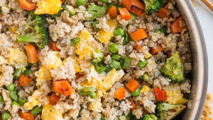 Easy Healthy Vegetable Fried Rice with brown rice, carrots, peas, bell pepper, and more
