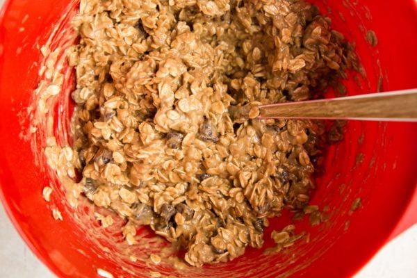 All of the ingredients for the breakfast oatmeal bars in a mixing bowl