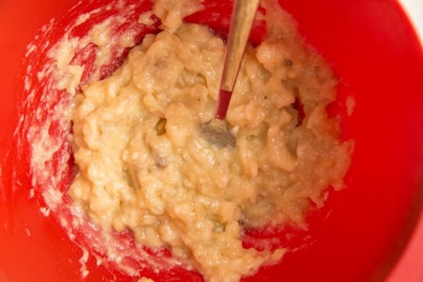 Mashed banana in a mixing bowl