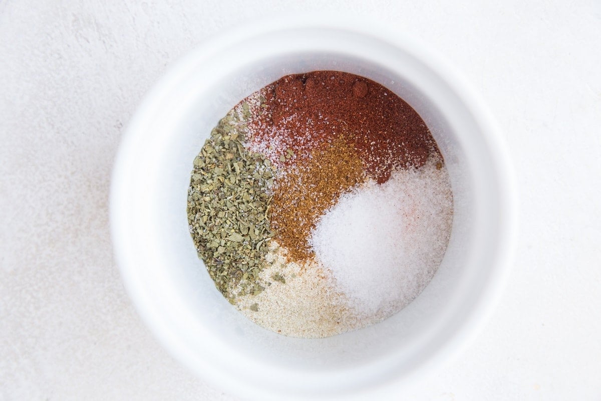 Seasonings for blackened chicken in a ramekin