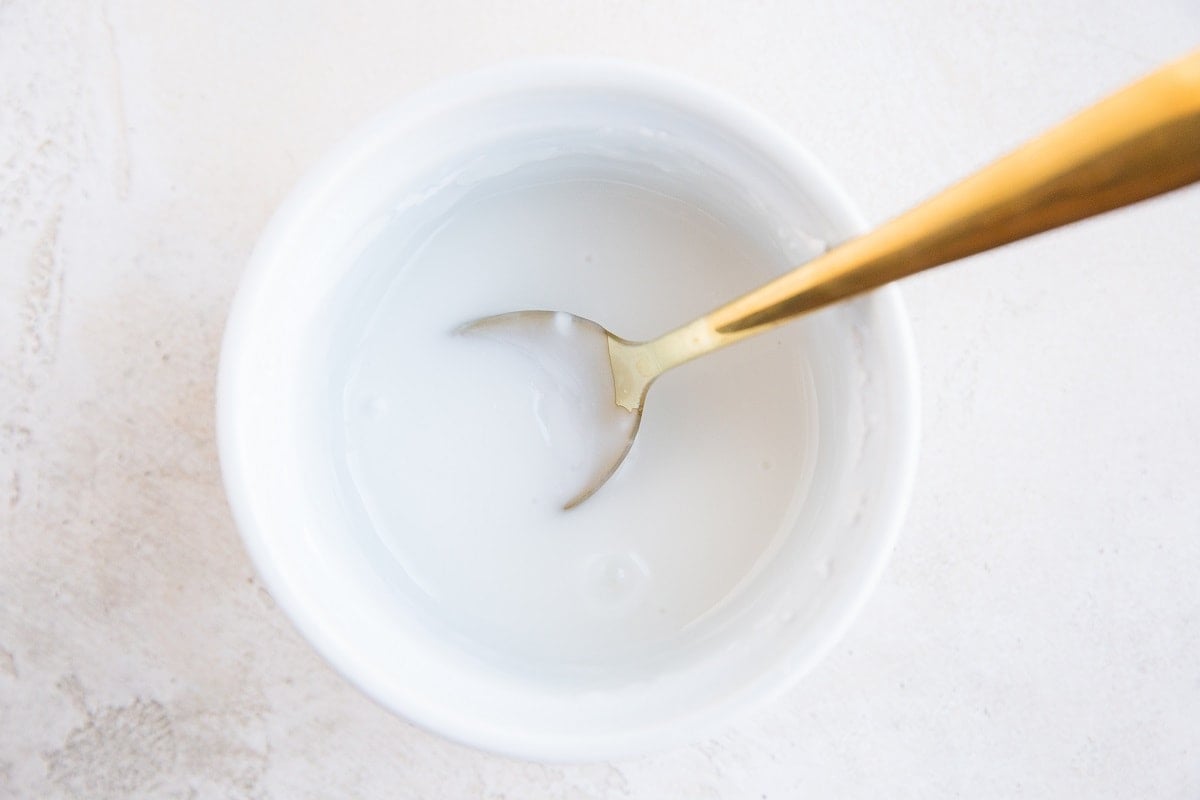 Bowl full of powder sugar glaze, ready to use.