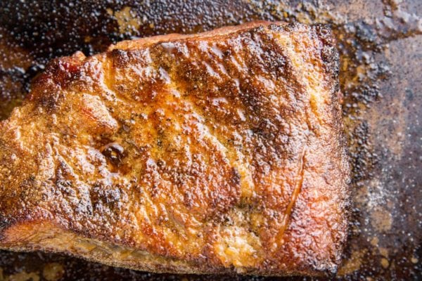 Cooked oven roasted brisket on a baking sheet