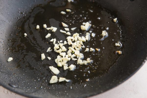 Sauté the garlic in the skillet