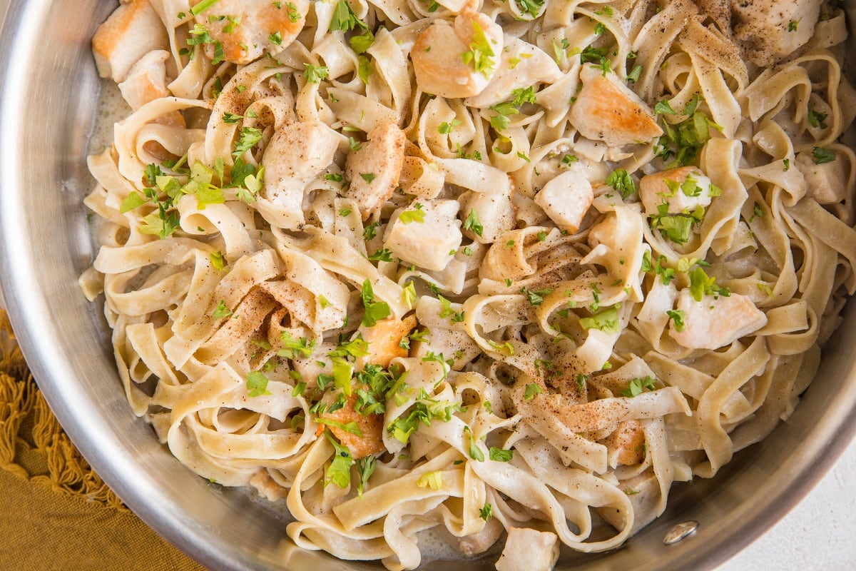 Finished healthy chicken alfredo in a skillet