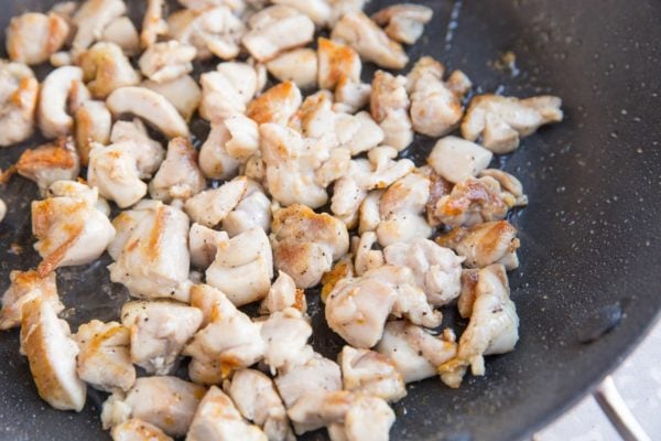 Chicken browning in a skillet