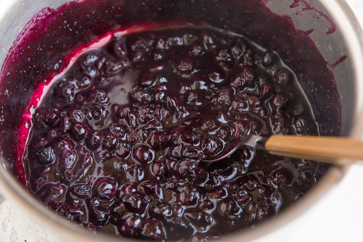 blueberry jam filling inside a saucepan ready to be turned into crumb bars