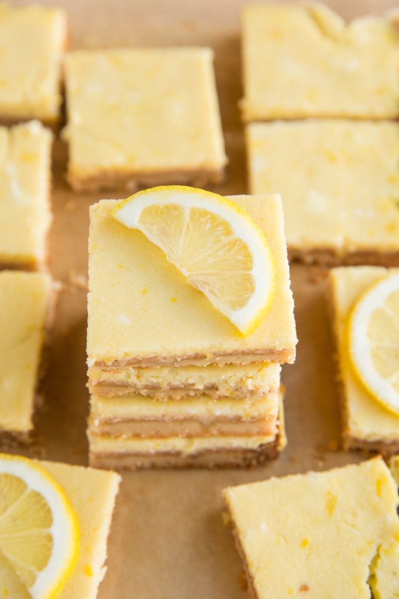 Stack of lemon bars with lemon bars off to the side