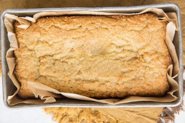 Finished pound cake in a bread loaf pan fresh out of the oven