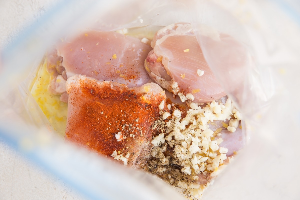 Ingredients for lemon garlic chicken in a zip lock bag