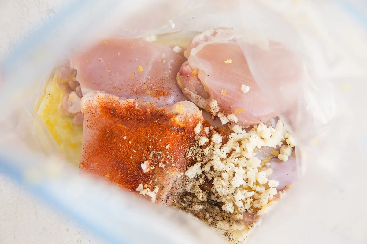 Ingredients for lemon garlic chicken in a zip lock bag