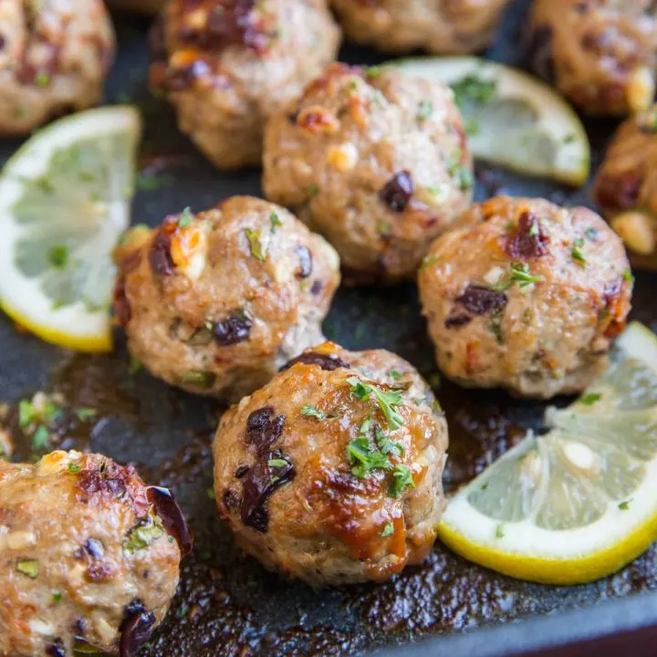 Mediterranean meatballs in a casserole dish fresh out of the oven