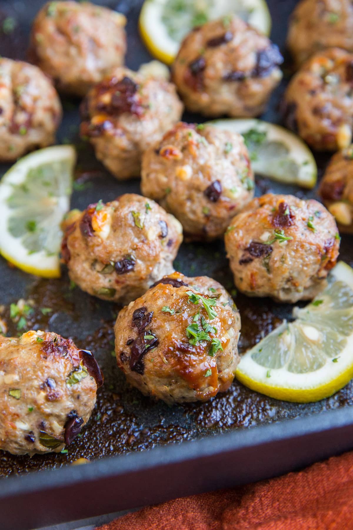 Mediterranean meatballs in a casserole dish fresh out of the oven