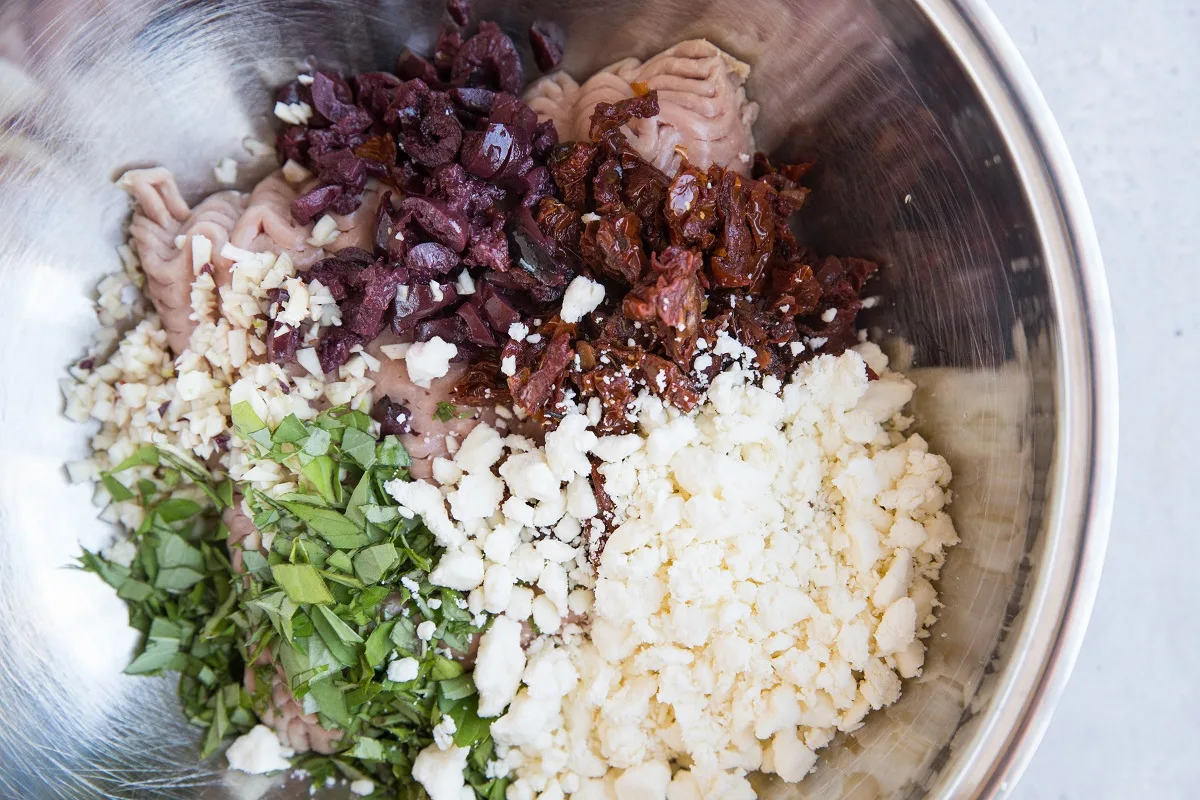 Ingredients for turkey meatballs in a mixing bowl