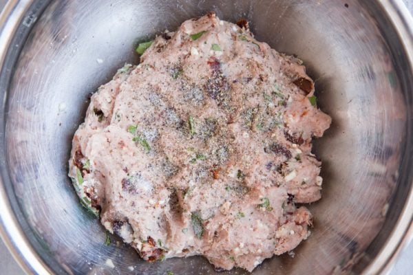 Meatball mixture in a mixing bowl