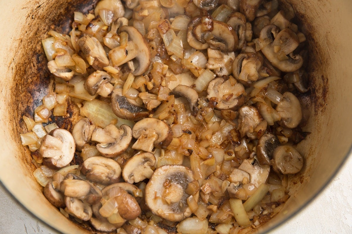 Mushrooms and garlic cooking in the dutch oven
