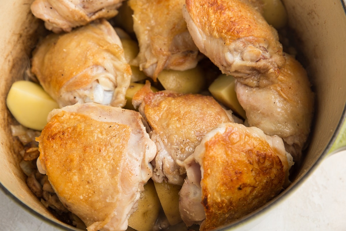 chicken and potatoes in a dutch oven