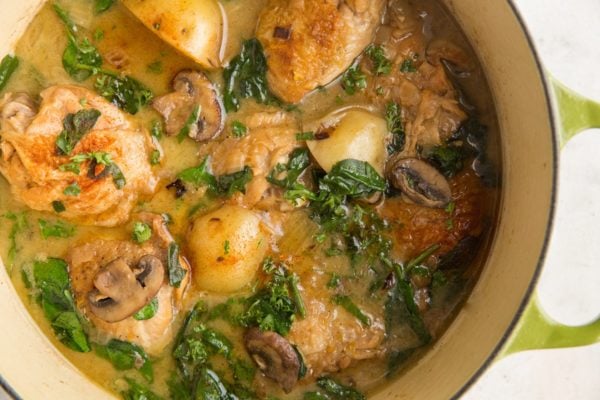 horizontal top down image of Dutch oven of creamy chicken and potatoes