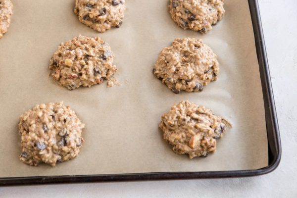 Mounds of banana cookie dough on a baking sheet