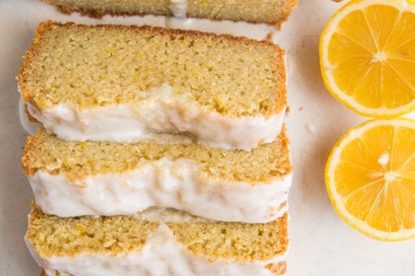 Horizontal image of paleo pound cake slices on a white surface