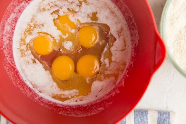 Eggs and melted butter in a mixing bowl