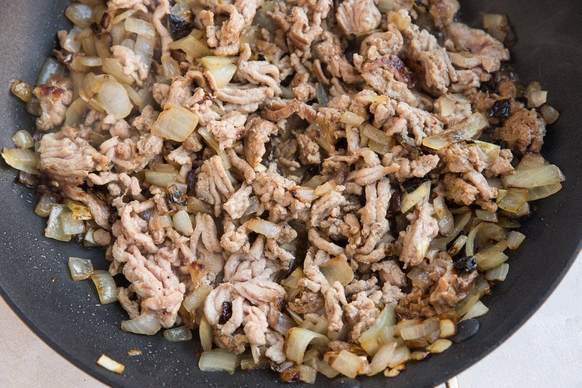 Ground turkey in a skillet with onion