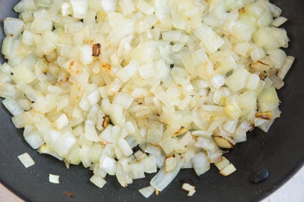 Onion sautéing in a skillet