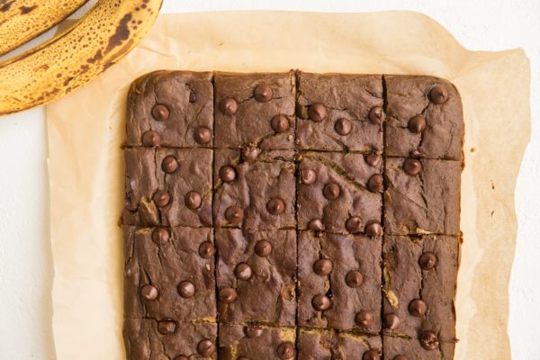 Sliced chickpea bars on parchment paper.