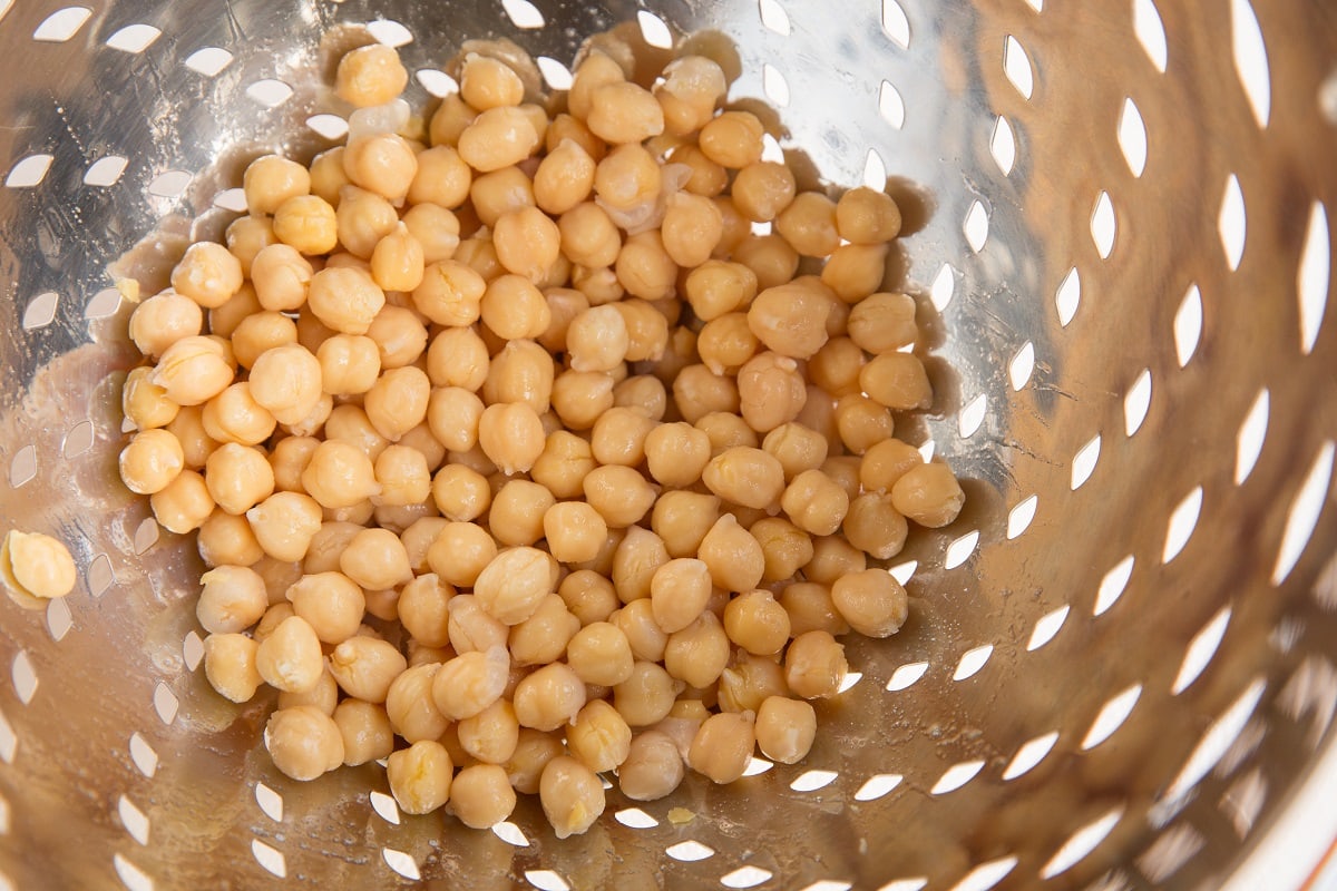 colander with chickpeas in it