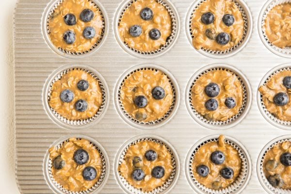 muffin tray filled with muffin batter