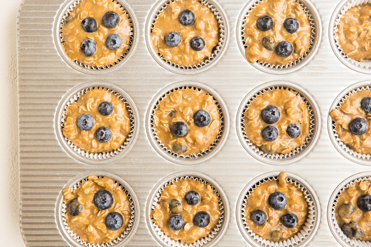 muffin tray filled with muffin batter