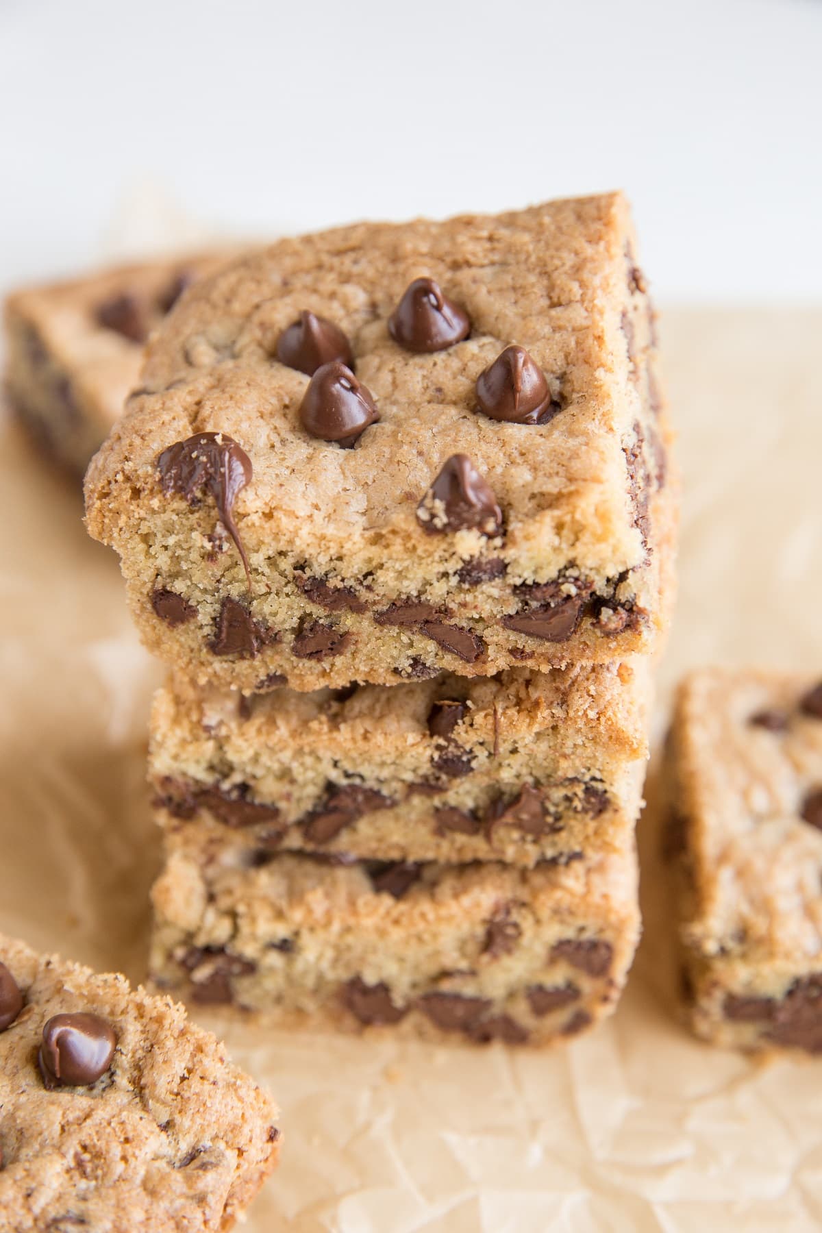 Stack of cookie bars on top of parchment paper