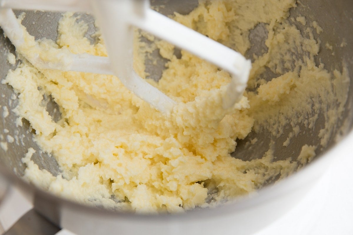 Butter, sugar and egg mixed together in a mixing bowl