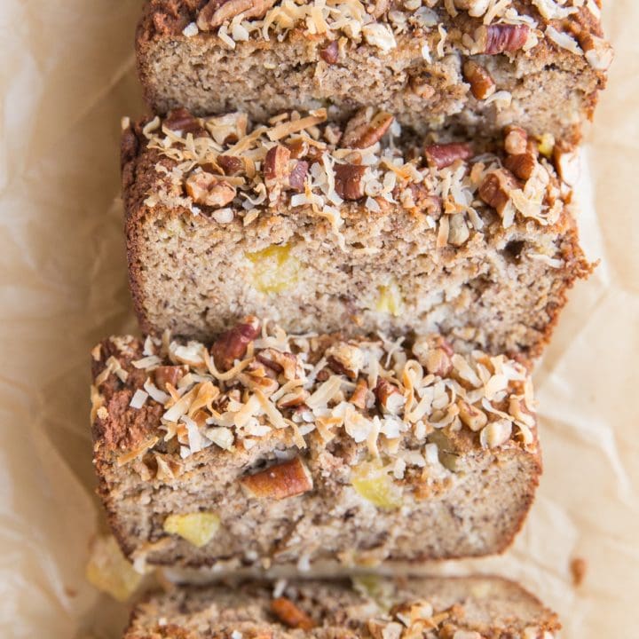 loaf of hummingbird bread on parchment paper, cut into slices