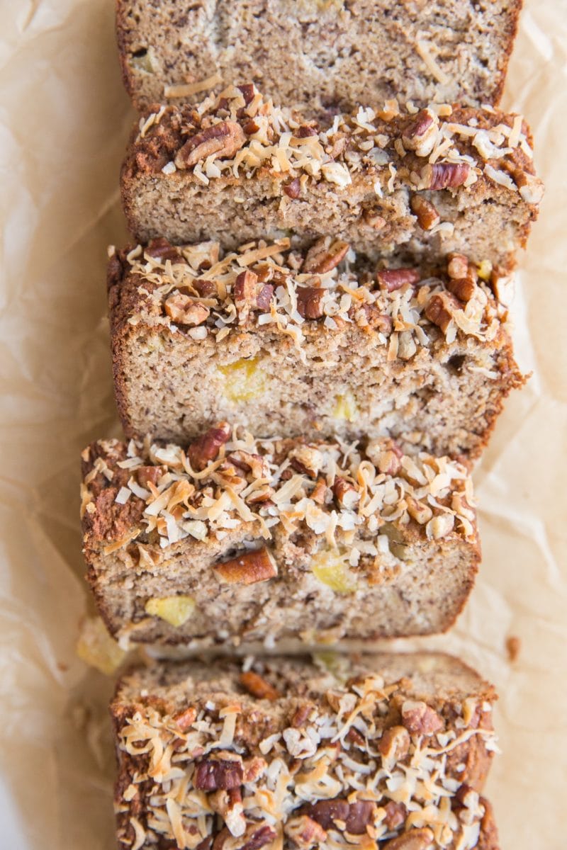 loaf of hummingbird bread on parchment paper, cut into slices