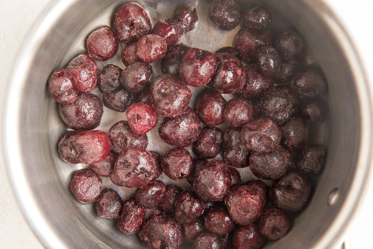 Frozen cherries in a saucepan