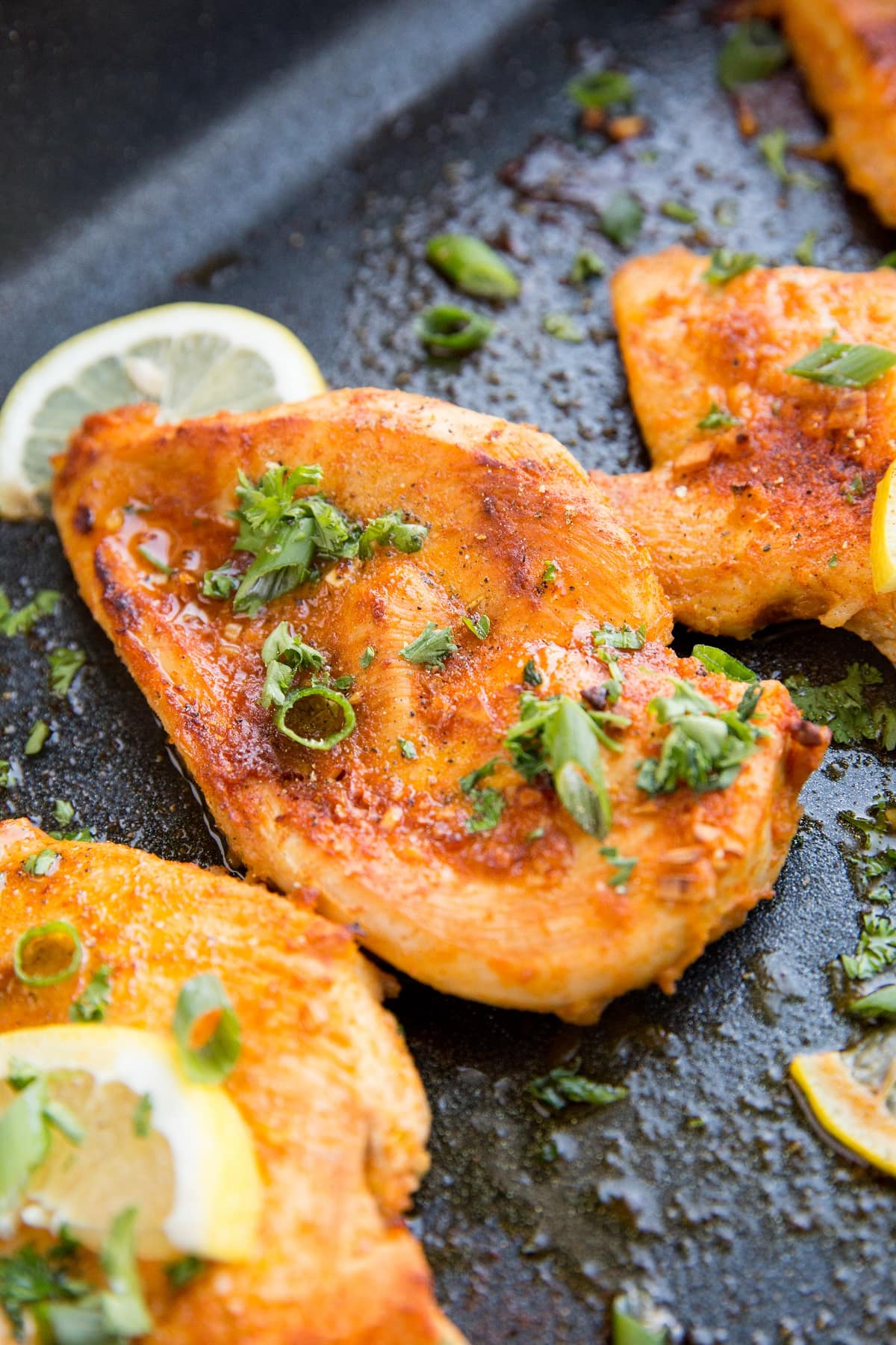 Roasting pan with lemon garlic baked chicken breasts