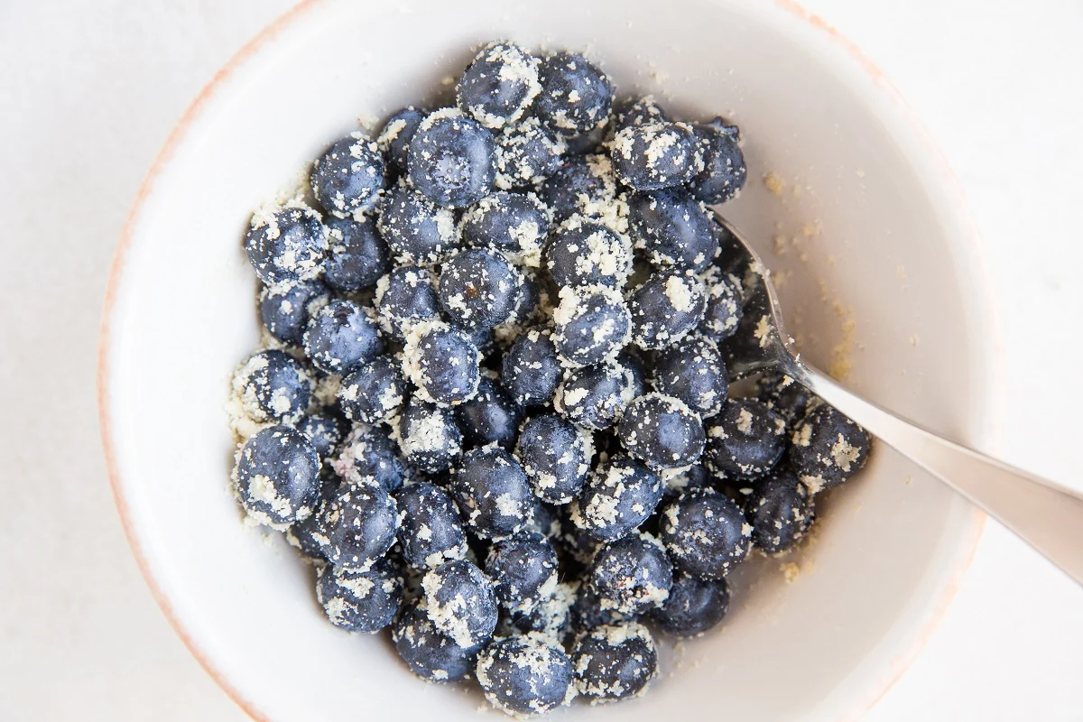 Blueberries in a bowl with flour