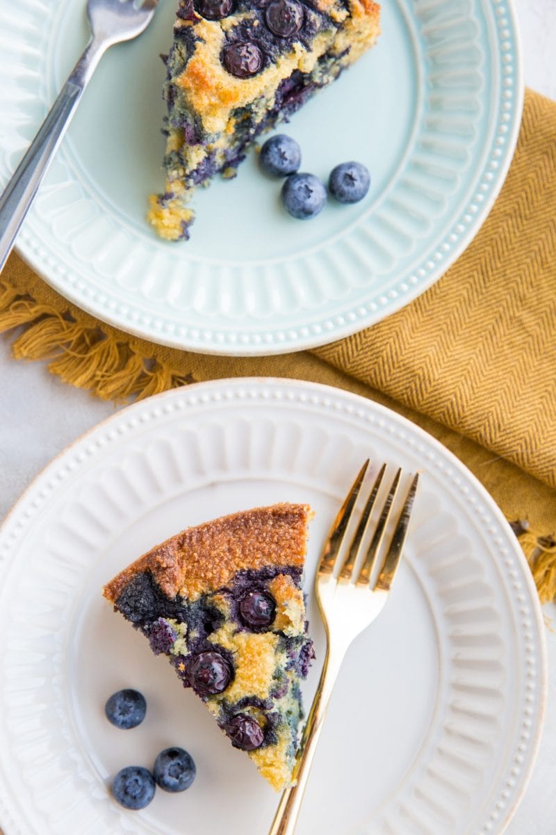 top down photo of two slices of cake on plates