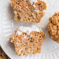 Carrot Cake Muffin sliced in half on a plate so you can see the inside