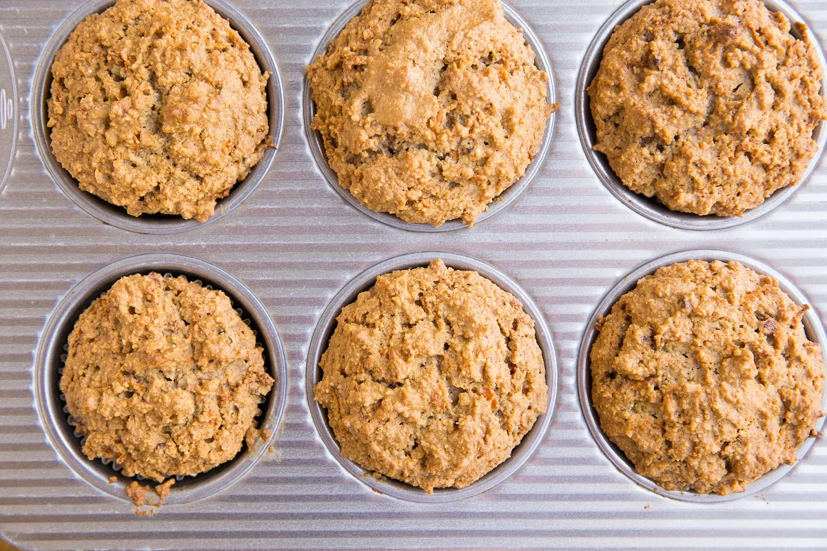 Carrot muffins fresh out of the oven in an oven tray