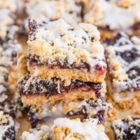 Stack of low-carb cherry pie bars on parchment paper