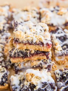 Stack of low-carb cherry pie bars on parchment paper