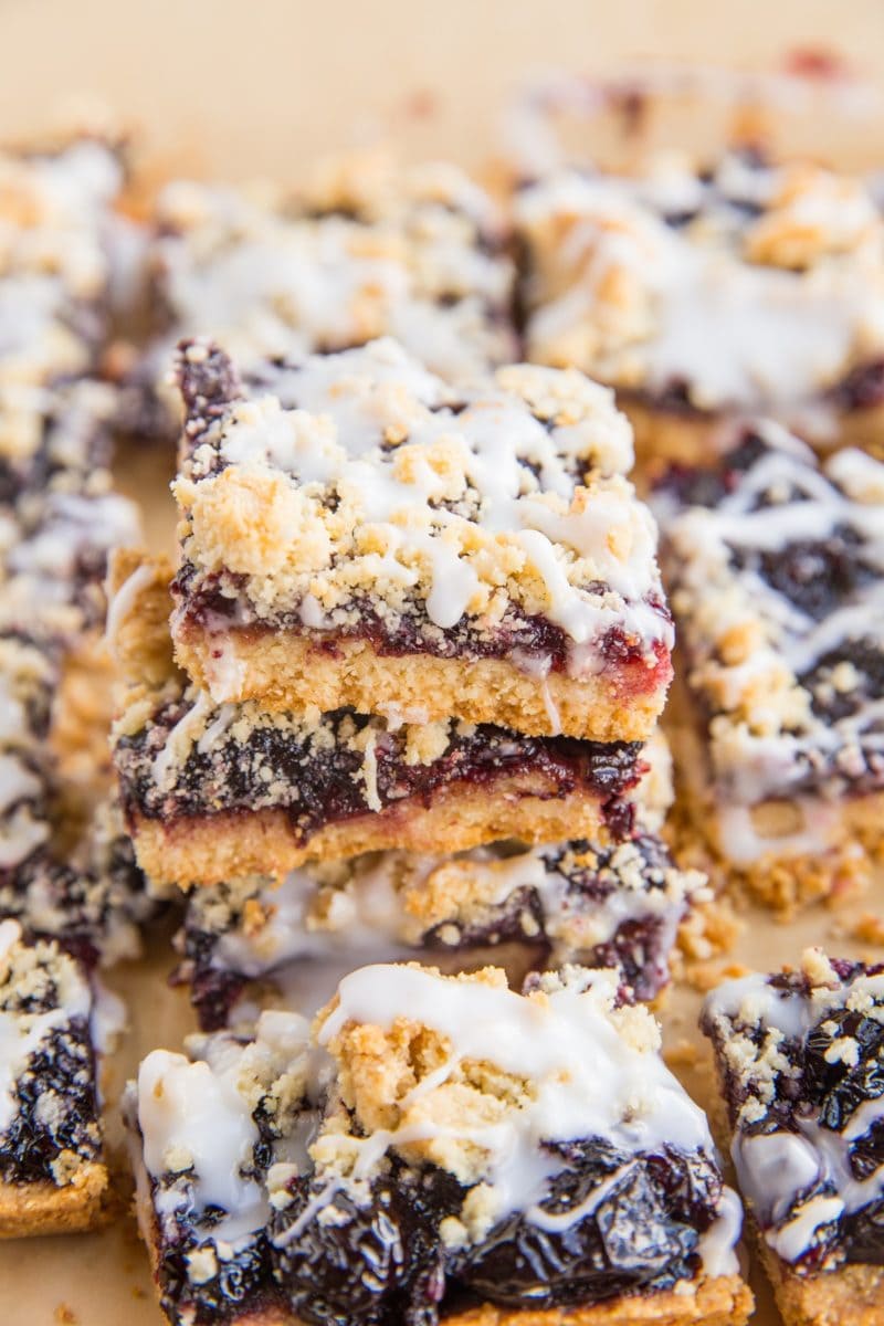 Stack of low-carb cherry pie bars on parchment paper