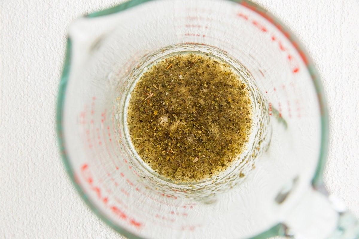 Ingredients for simple vinaigrette in a measuring cup