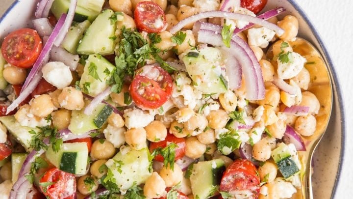 Big bowl of chickpea salad with fresh vegetables